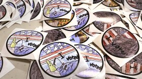 "I Voted" stickers, which were designed by New Hampshire fourth grade students, are displayed on a table at Pinkerton Academy , Tuesday, Jan. 23, 2024, in Derry, N.H., as New Hampshire's famously independent-minded electorate makes its pick for the 2024 presidential nominees.