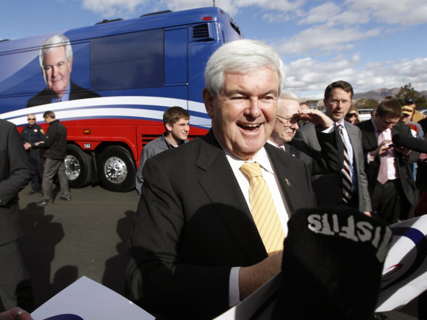 Newt Gingrich greets supporters during a campaign appearance at a restaurant in Reno, Nev., on Wednesday. He said Thursday he will challenge Florida's winner-take-all scheme for awarding delegates. 