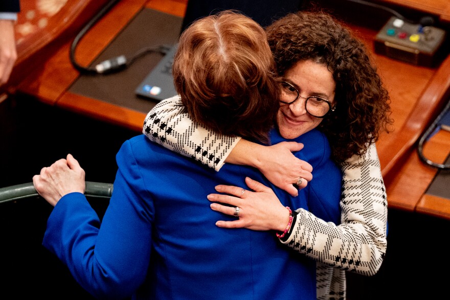 Rep. Mary Beth Canty (D-Arlington Heights) embraces Sen. Ann Gillespie (D-Arlington Heights) on Wednesday, Feb. 15, 2023, following Gov. J.B. Pritzker’s budget address at the Illinois State Capitol in Springfield, Ill.