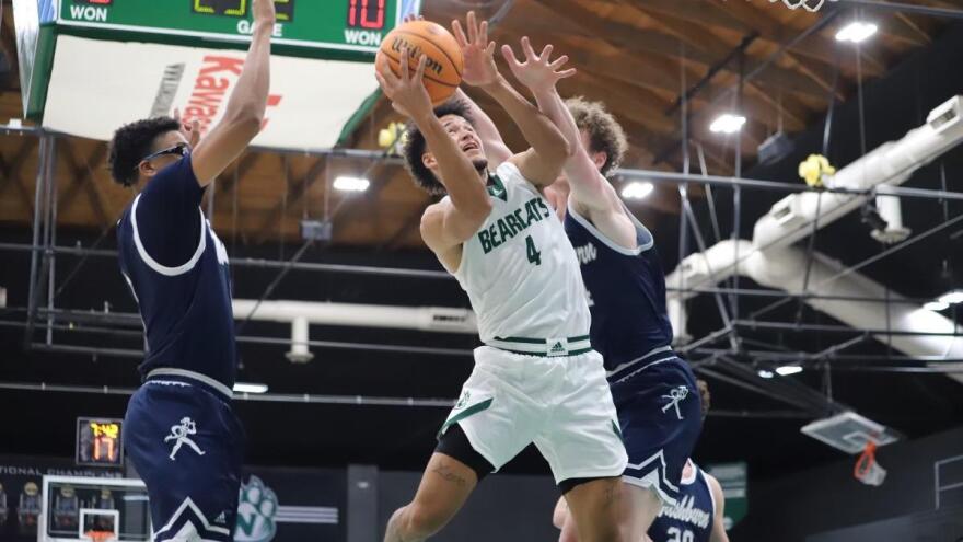 Action shot of Isaiah Jackson vs Washburn basketball