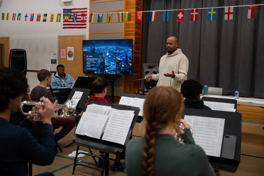 Mark Dawson, principal at Dr. Etheldra Davis Fairview Elementary School, leads the marching band camp through their scales.