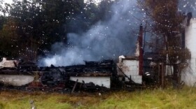 Smoke and debris is all that is left of the old Pentecostal church in Turley.