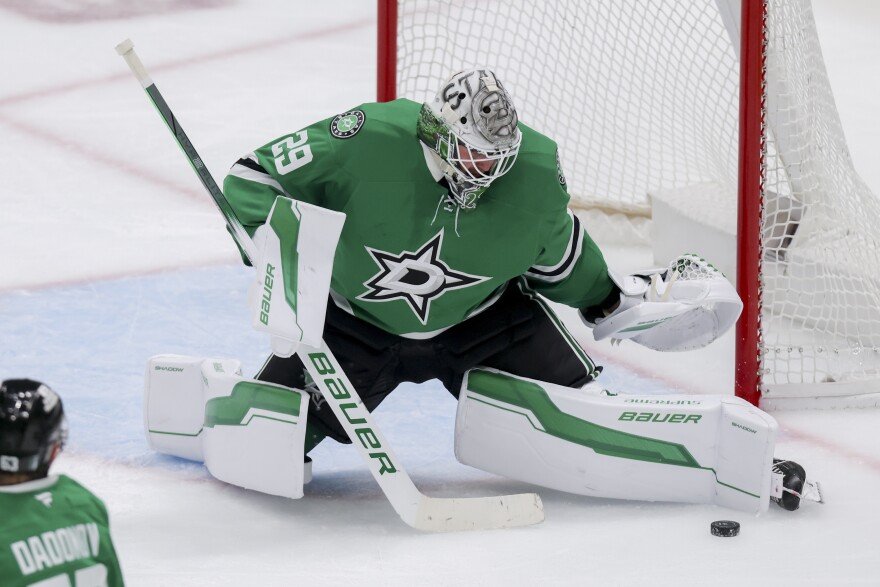 Dallas Stars goaltender Jake Oettinger blocks a shot in the third period of Game 4 of a second-round NHL hockey playoff series in Dallas, Tuesday, May 13, 2025.