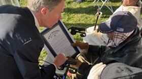 Indianapolis Mayor Hogsett presents Albert Arnold, whom the new homes are named after, with a proclamation.
