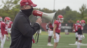Indiana coach Tom Allen barks out instructions through a megaphone at practice.