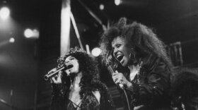 Love performs with Cher at Fox Theater in 1989. After hitting rock bottom taking up work as a house cleaner, Love made her way back to the stage preforming in New York and Los Angeles and singing backup vocals for Cher and U2.