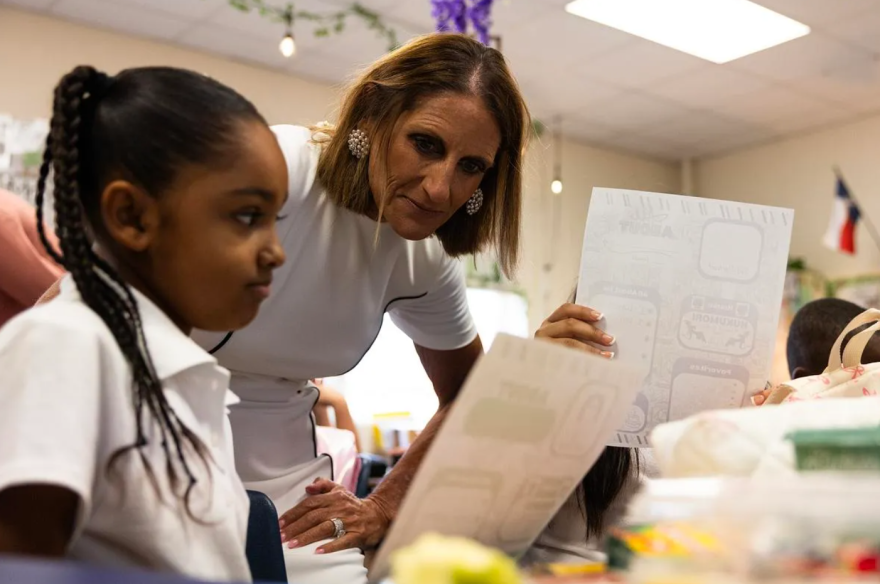 Superintendent Karen Molinar reads over an ice breaker assignment in a classroom at Mary Louise Phillips Elementary in Fort Worth during FWISD’s first day of school Aug. 12, 2025.