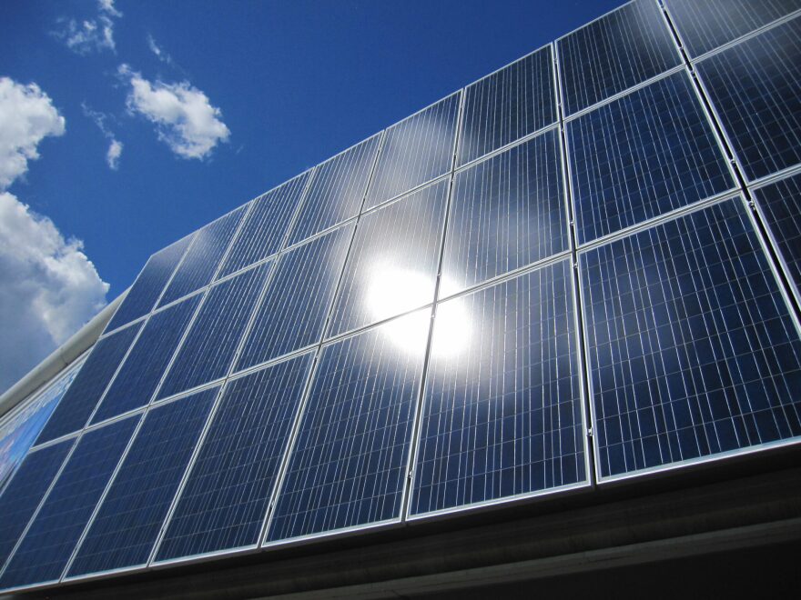 Sunlight reflects off solar panels lining the student recreation building at the University of Alaska Fairbanks campus on June 2, 2018.
