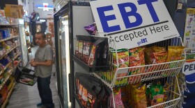 FILE - A banner reads: "EBT (Electronic Benefit Transfer) Accepted Here," at El Recuerdo Market in Los Angeles, Oct. 31, 2025, after two federal judges ordered President Donald Trump's administration to continue funding SNAP during the government shutdown. (AP Photo/Damian Dovarganes, file)