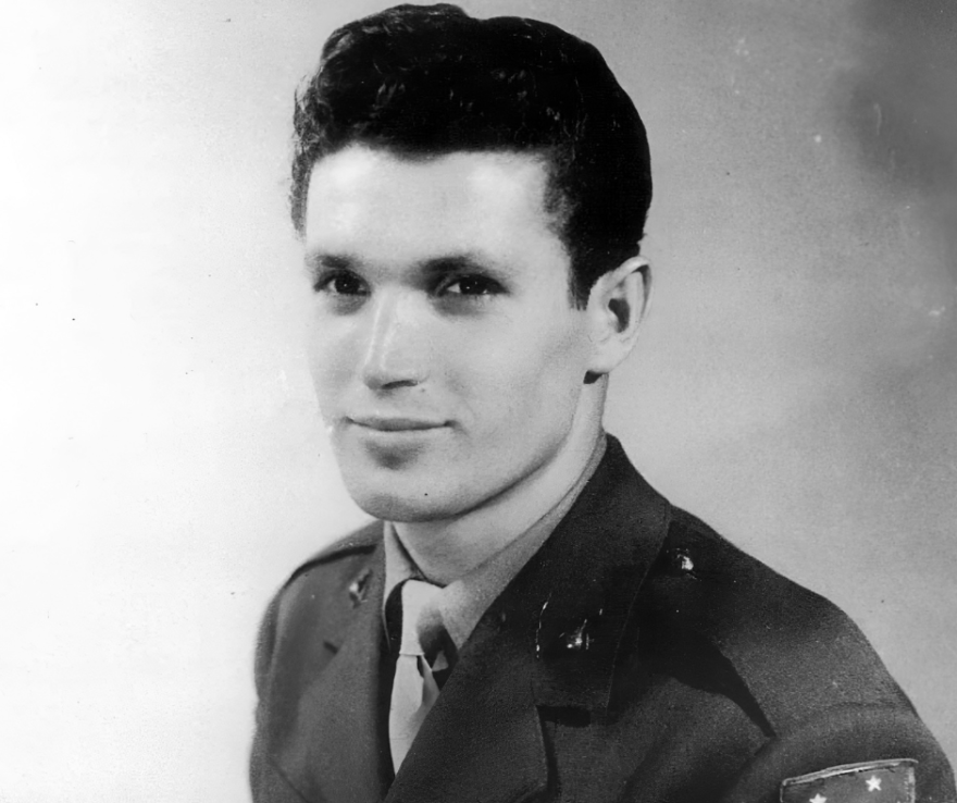  A portrait of a young man who was a World War II veteran, dressed in a U.S. military uniform, looking toward the camera. The photo appears to be from the World War II era.