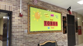 A bulletin board inside SAISD's Tafolla Middle School that says "Good planning and hard work leads Toros to success."