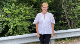 Town Branch Park Executive Director Allison Lankford in front of Town Branch Creek