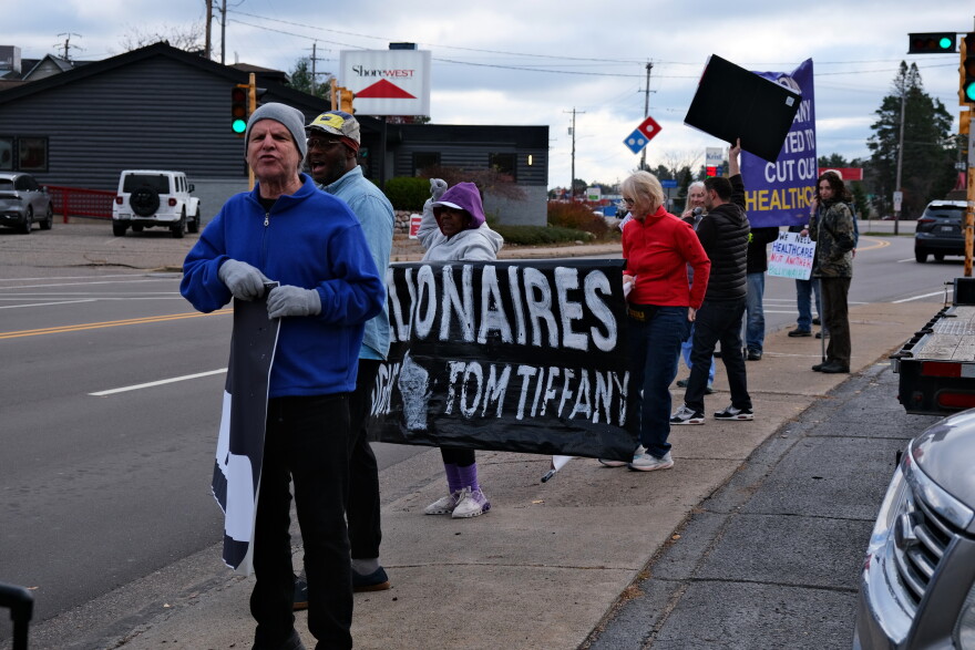 People protest Wisconsin Republican Gubernatorial Candidate Tom Tiffany's campaign stop in Rhinelander on Thursday, October 29, 2026. Tiffany says the group follows him to different stops.