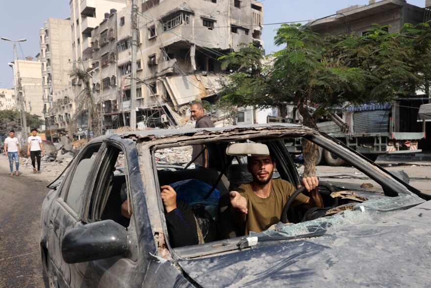 Sat., Oct. 28: A man drives a damaged car following Israeli strikes in Gaza City.