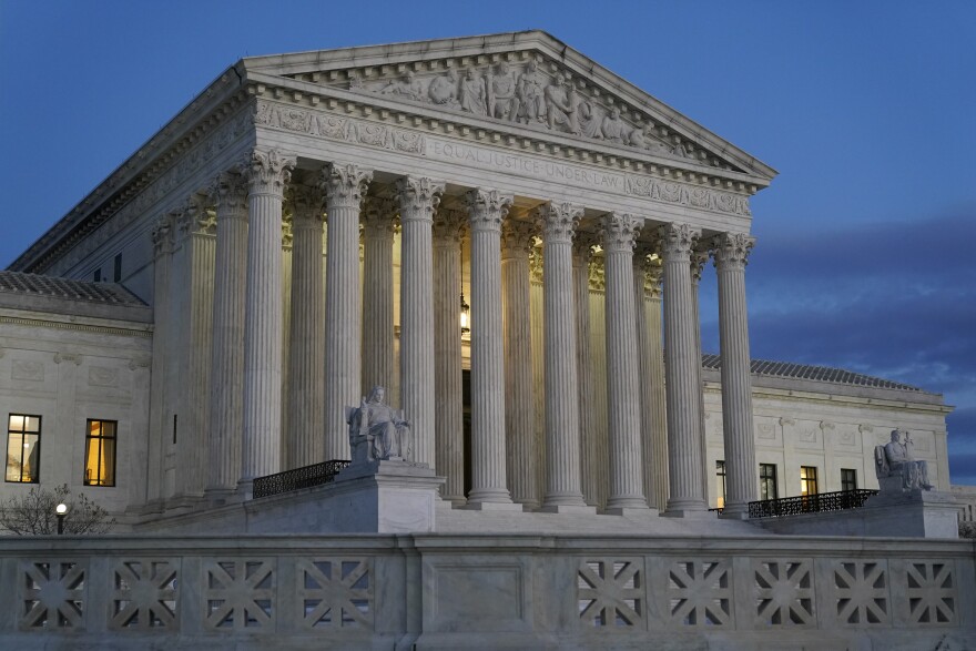Light illuminates part of the Supreme Court building at dusk on Capitol Hill in Washington on Nov. 16, 2022. 