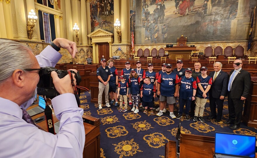 The Wyoming Valley Challenger team poses for a photo with Reps. Eddie Day Pashinski and Jamie Flick on the House floor.