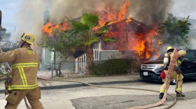 Firefighters battle Wednesday morning house fire in Santa Barbara which left one person injured.
