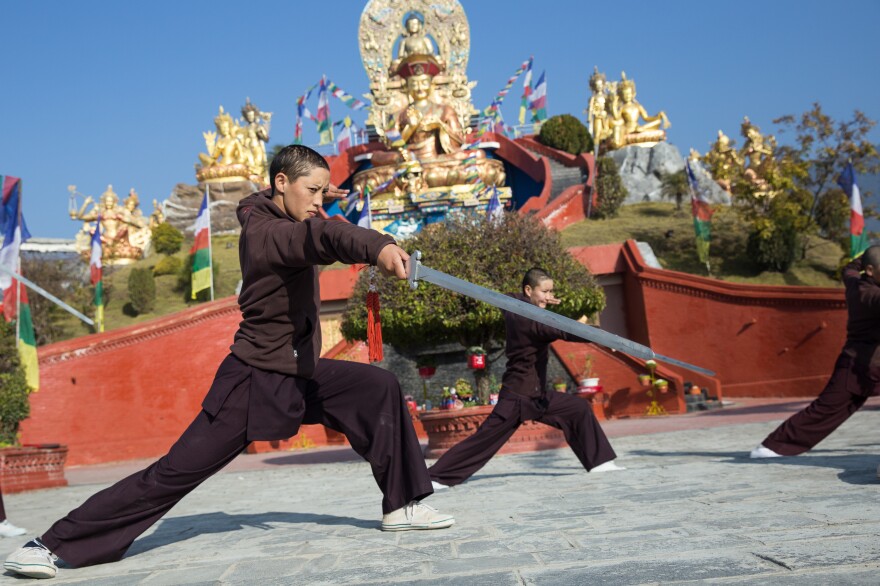 The nuns wield spears and dance in formation during their practice sessions.