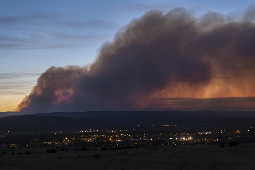 Smoke from the Calf Canyon/Hermits Peak Fire drifts over Las Vegas, N.M., on Saturday.