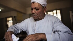 In Cairo, a man casts his ballot earlier today.