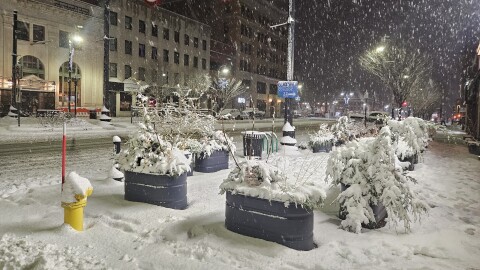 Snow falls on downtown Pittsfield, Massachusetts, on the evening of December 2nd, 2025.