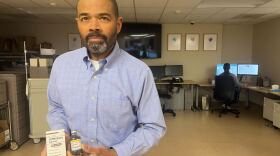 A man holds prescription drugs.