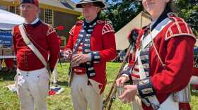 Revolutionary reenactors portray members of the Royal Army