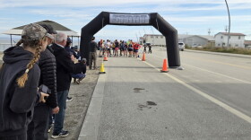 Spectators watch before the start of the Cape Blossom marathon on August 29.