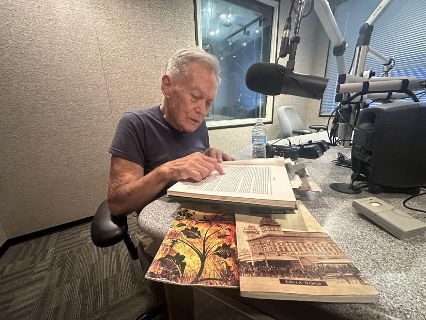 Owner of the Louis Emerson House, Robert Young, reads over the history of his historic property.