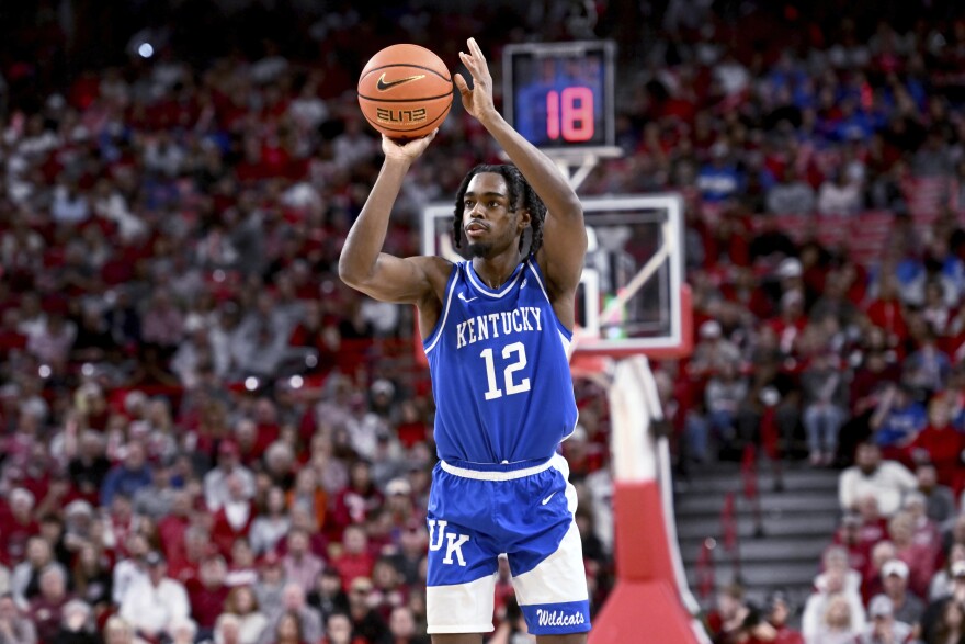Kentucky guard Antonio Reeves (12) shoots against Arkansas during the first half of an NCAA college basketball game Saturday, Jan. 27, 2024, in Fayetteville, Ark. (AP Photo/Michael Woods)