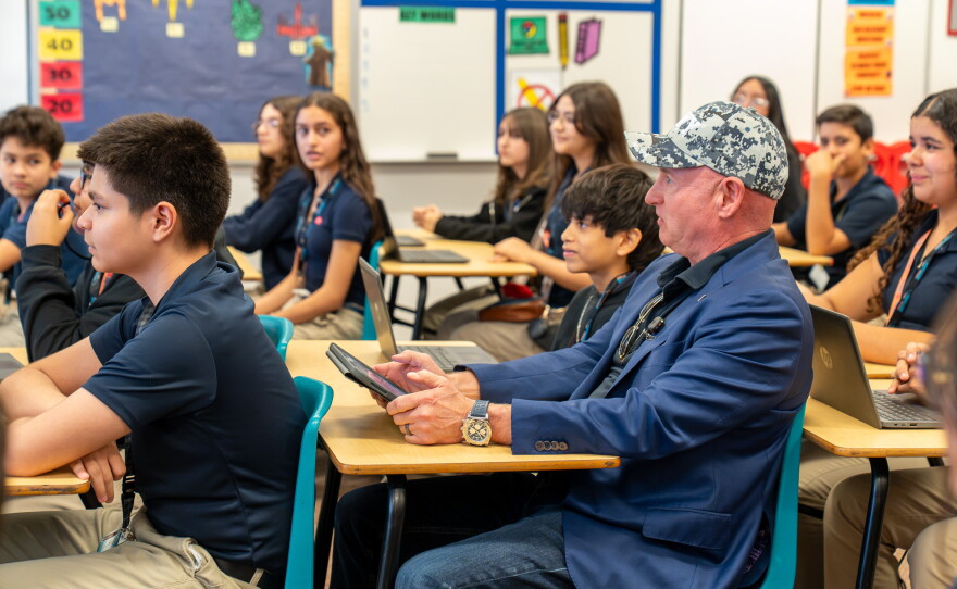Sen. Mark Kelly sits in class with students from Southwest Early College Academy — formerly known as Southwest Junior High.