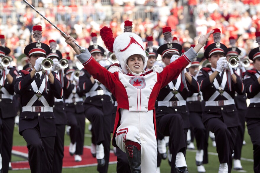 Ohio State Marching Band drum major performs at halftime of an Ohio State football game