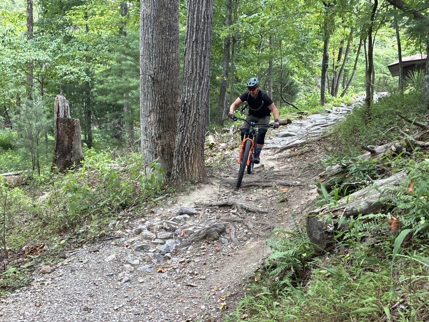 Roanoke mountain biker Mark Boyer drops down a trail at Carvins Cove Natural Reserve.