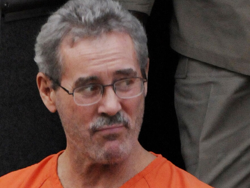 Financier Allen Stanford steps off a prison transport bus at the federal courthouse for a hearing Sept. 15.