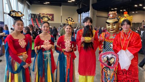 Local students dress up as Chinese princesses and money gods to celebrate Lunar New Year at the Spokane Convention Center.