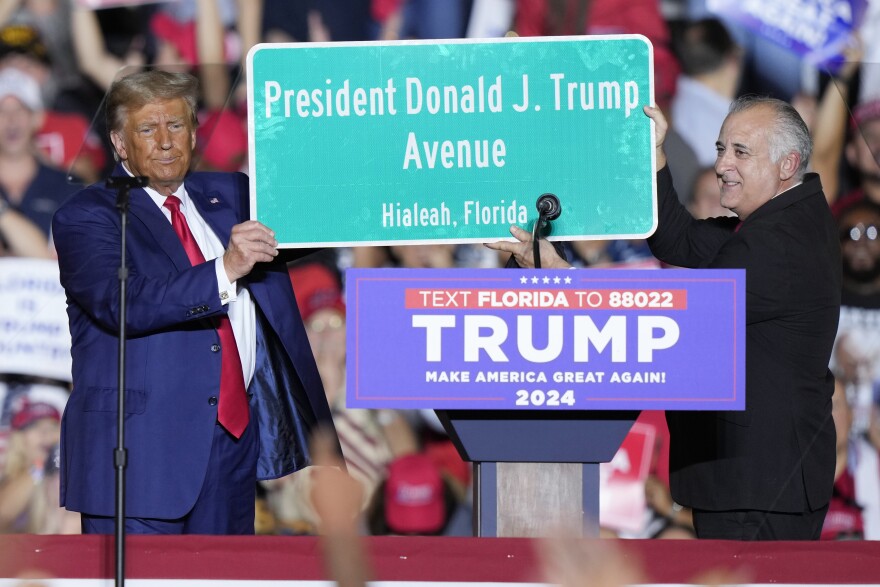 Constitutional Contempt: Former President and 2024 GOP presidential candidate Donald Trump holds a sign with Hialeah Mayor Esteban Bovo at a campaign rally in Hialeah, Fla., Wednesday, Nov. 8, 2023. The sign reflects Bovo's plans to name a street in Hialeah for Trump.