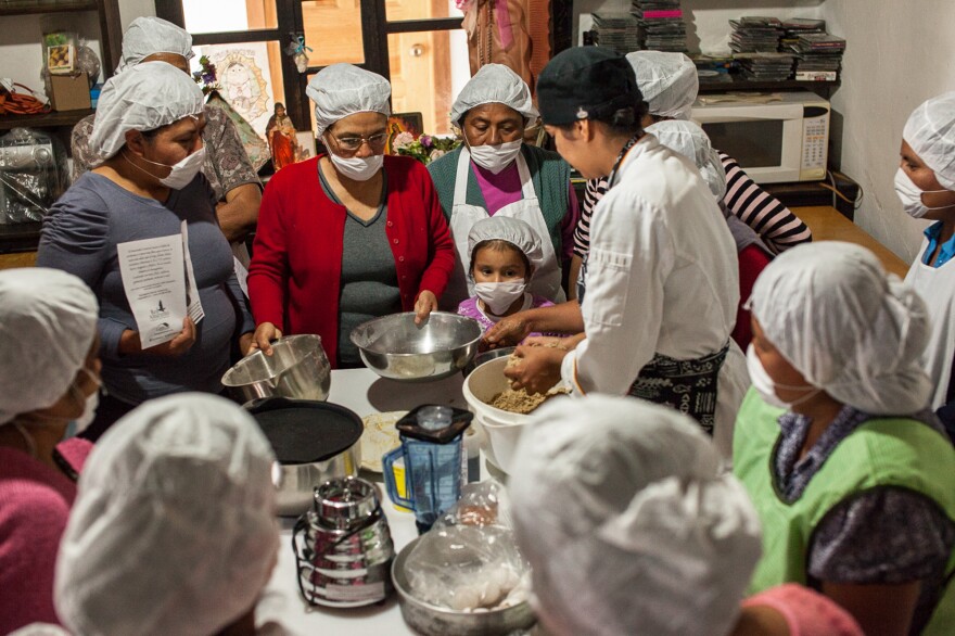 Gastronomy student Clarissa Moran (center) works with women in microenterprise groups to create new products with amaranth.