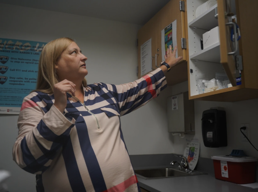 Dorothy Waterhouse, program director for the syringe exchange program at the Clark County Health Department, opens a cabinet containing supplies used for the program Tuesday, Nov. 23, 2025, in Jeffersonville, Ind.