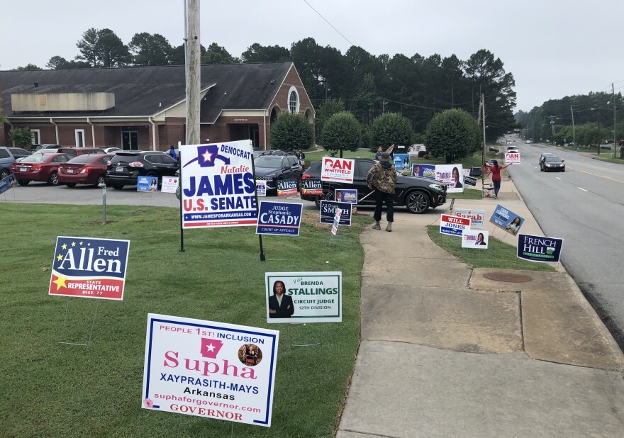 Campaign signs dot the landscape outside a polling place in Little Rock's John Barrow neighborhood on Tuesday.