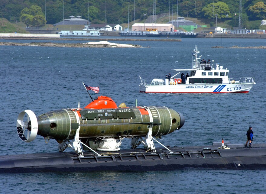 Sister vessel to Morro Bay's rescue vessel DSRV-1 Mystic Sasebo, Japan (Apr. 25, 2002) -- The U.S. Navy Los Angeles attack submarine USS La Jolla (SSN 701) with the deep submergence rescue vehicle Mystic (DSRV-1) attached, is escorted by the Japanese Coast Guard as it pulls out of Sasebo harbor to participate in the submarine rescue Exercise Pacific Reach 2002. La Jolla and Mystic will operate with surface ships and submarines from the U.S., Japan, Australia, the Republic of Korea and the Republic of Singapore during Exercise Pacific Reach. Mystic was specifically designed to fill the need for an improved means of rescuing the crew of a submarine immobilized on the ocean floor. It can operate independently of surface conditions or under ice for rapid response to an accident anywhere in the world. U.S. Navy photo by Journalist 3rd Class Wes Eplen. (RELEASED)