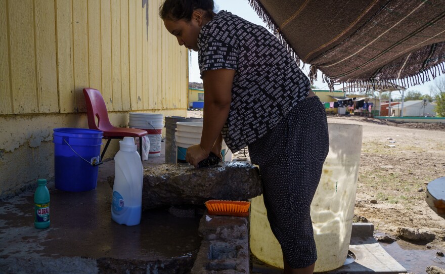 Carolina washes clothes at Pan de Vida Migrant Shelter in Ciudad Juárez on September, 6, 2020.