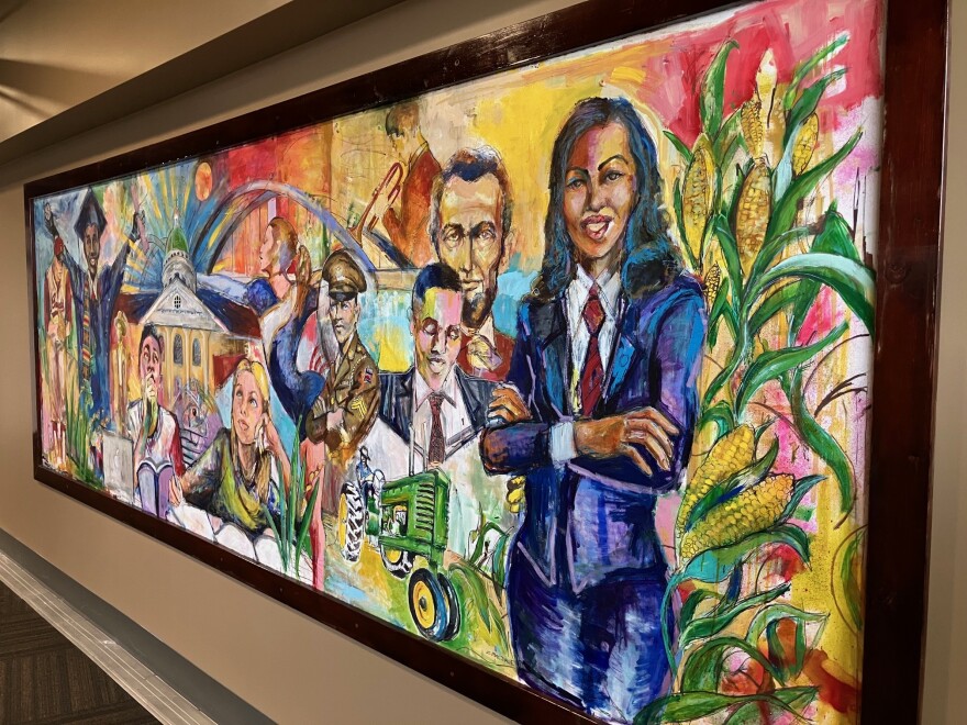 The Quad Cities mural Sampson painted in 2019, commissioned by Dave Heller, to honor his Bandit Scholars program, which he says is the largest college scholarship program in minor-league baseball.,