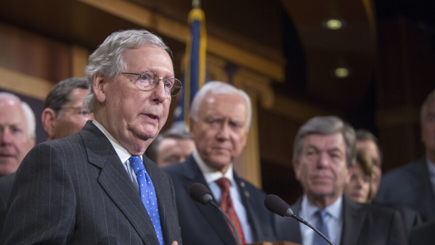 Senate Majority Leader Mitch McConnell (left) speaks at the press conference after the senate vote of the tax reform bill on Wednesday in Washington, D.C