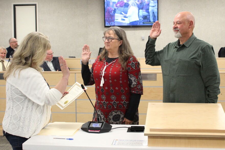 From left, Kenai Peninsula Borough Clerk Michele Turner swears in newly-elected assembly members Cindy Ecklund and James Baisden during an assembly meeting on Tuesday, Oct. 8, 2024 in Soldotna, Alaska.