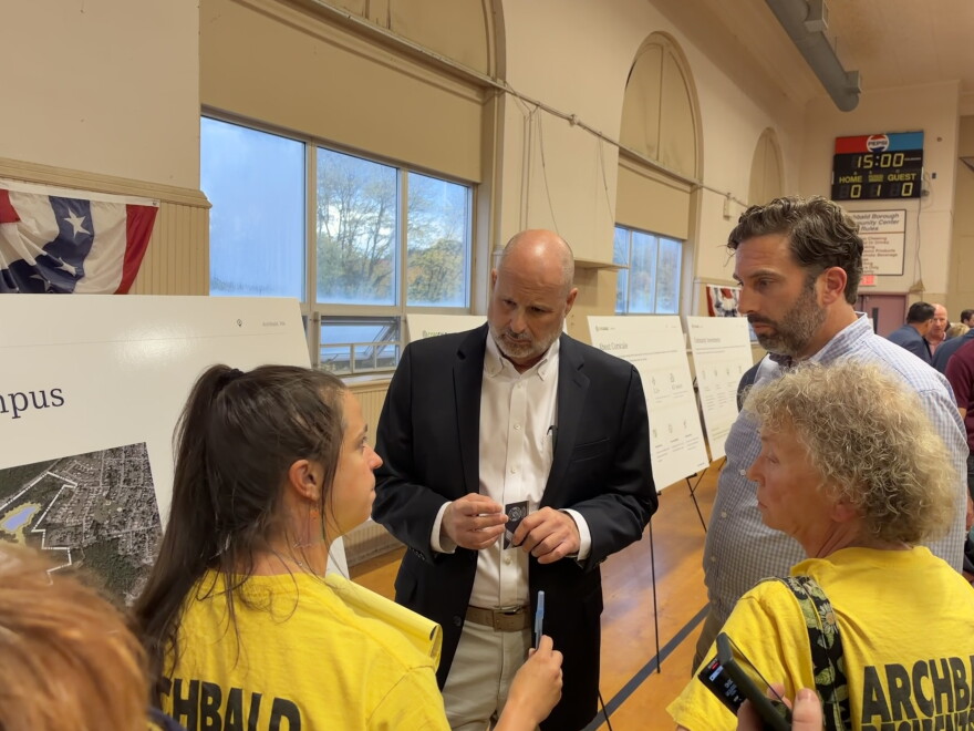 Archbald resident and cofounder of Stop Archbald Data Centers Tamara Misewicz-Healey, left, questions Erik Draaisma, executive vice president of business development for Corscale, during an open house for the Project Gravity Data Center Campus.
