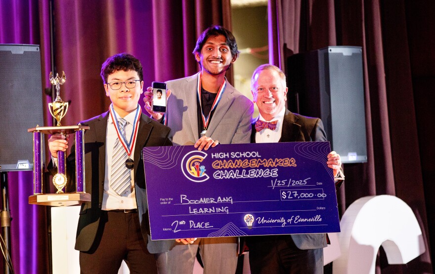 Boomerang Learning team members stand with with UE President Chris Pietruszkiewicz.