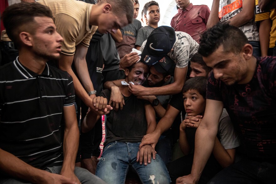 Relatives of Lian al-Shaer, a 10-year-old Palestinian girl, mourn during her funeral ceremony in Khan Yunis in the southern Gaza Strip on Aug. 11. Lian died of injuries sustained during the violence between Israel and Islamic Jihad.
