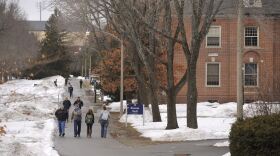 Students walk across campus at the University of Maine in Orono.