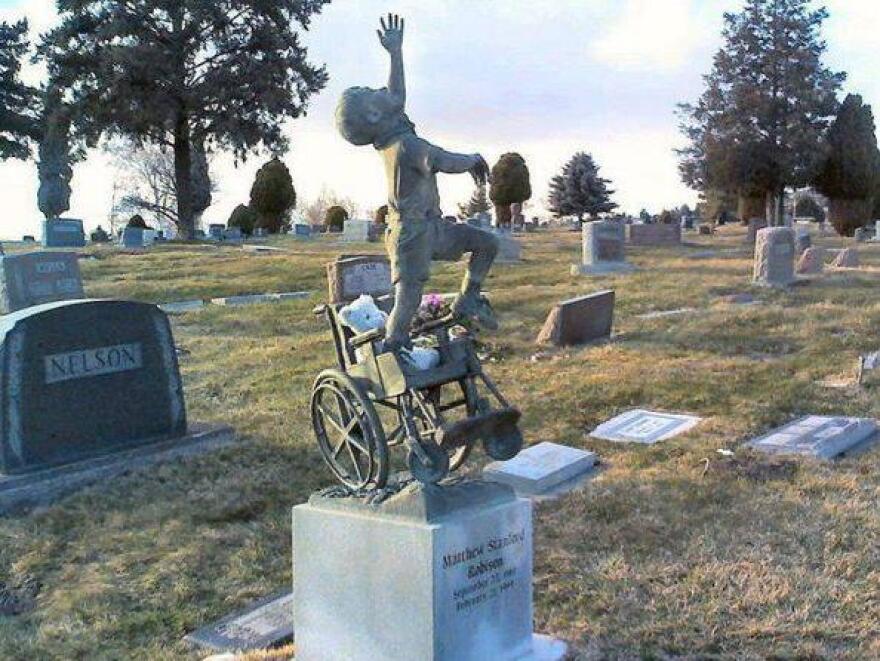 Matthew Robison's gravestone has also become popular on social networks online and among cemetery visitors — many place stuffed animals and other toys on the headstone.