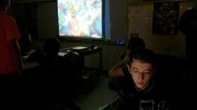 During a team meeting, Jeremy Murray starts and stops a video of a match the Francis Howell Central High School esports club students played earlier in the week. 